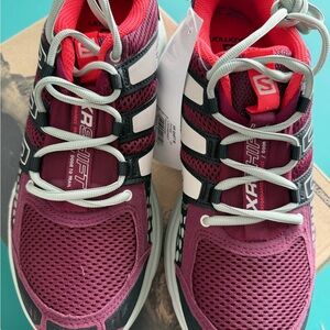 Salomon women’s Burgundy and Black Athletic/Trail Running Shoes